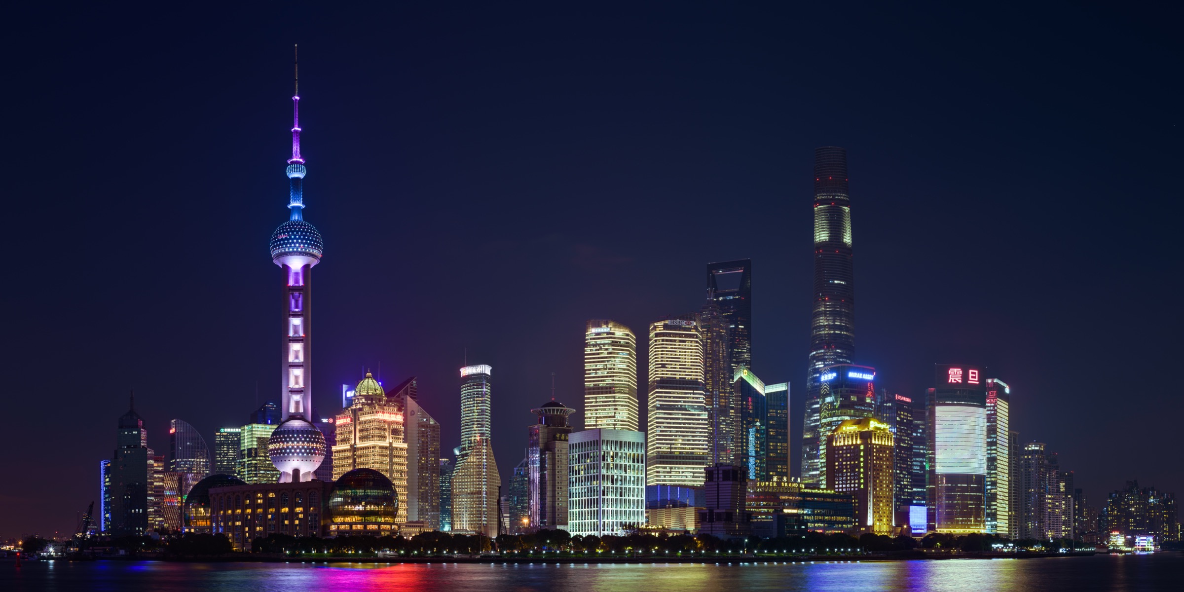 Shanghai’s Oriental Pearl Tower and Pudong skyline illuminated at night